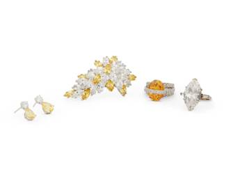 1160 A Group of Simulant Jewelry Including a silver and simulant diamond ring, a silver, yellow stone and colorless stone ring together with white metal and simulant stone brooch and earring set Rings: 4 3/4 and 6 1/2, Brooch: 2 1/2 x 1 1/2 in., Earrings: 5/8 in. 51.7 grams gross This lot is being offered with no reserve Estimate: $100 - $200