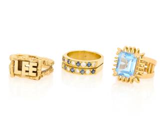 1154 A Group of Three 18K Gold Rings Including a double diamond and sapphire set ring, one featuring the name of 'Lee' and one centering a synthetic blue spinel 3 pieces Sizes: 7 1/4, 7 1/2, 5 1/2 30.7 grams gross Estimate: $2,800 - $3,500