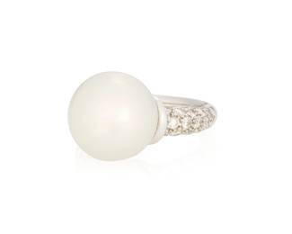 1056 An 18K White Gold, Cultured Pearl and Diamond Ring Centering a large cultured pearl measuring approximately 12.75 mm, accented by round diamonds Size: 4 1/2 8.5 grams gross Estimate: $800 - $1,200