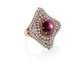 1092 A Mughal Style 14K Bi-Color Gold, Star Ruby and Diamond Ring Centering an oval star ruby cabochon measuring approximately 15.57 x 12.51 mm, accented by rose-cut diamonds set in a concave design Size: 8 1/4 26.4 grams gross Estimate: $1,500 - $2,000