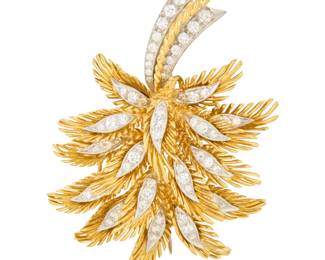 1106 An 18K Gold, Platinum and Diamond Brooch Of a foliate design accented by round diamonds weighing approximately 1.64 carats, with makers mark Measures: 2 1/4 x 1 1/2 in. 23.0 grams gross Estimate: $2,000 - $2,500