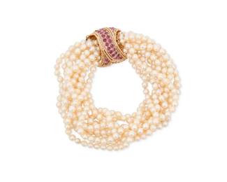 1017 A 14K Gold, Cultured Pearl and Ruby Bracelet Featuring eleven strands of cultured pearl beads measuring approximately 4.9 mm, finished with a gold and ruby cabochon clasp Length: 7 3/4 in. 92.6 grams gross Estimate: $800 - $1,200