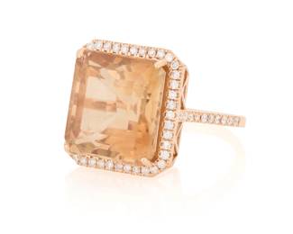 1138 An 18K Rose Gold, Topaz, and Diamond Ring Centering a square emerald-cut topaz weighing appropriately 14.60 carats, accented by round diamonds in an openwork design Size: 6 3/4 8.3 grams gross Estimate: $1,800 - $2,500
