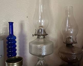 Collection of Vintage Oil Lamps, Brass Candlestick, and Cobalt Blue Bottle fourth image