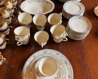 A complete 12 place settings of classic Bellemeade pattern by Minton Fine China in pristine condition!