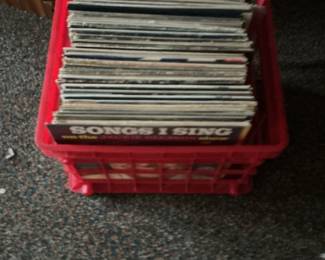 Collection of Vinyl Records in Red Crate
