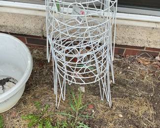 Assorted Metal Garden Ornaments including Wind Spinners, Stakes, and Planters