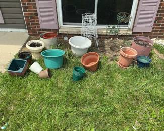 Assorted Plastic and Terra Cotta Planters and Plant Stands