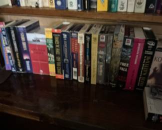 Assorted Paperback Books and Audio Cassettes