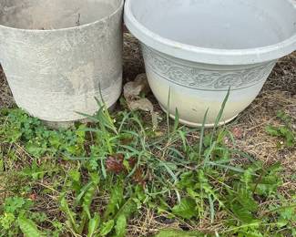 Assorted Metal Garden Ornaments including Wind Spinners, Stakes, and Planters