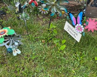 Assorted Metal Garden Ornaments including Wind Spinners, Stakes, and Planters
