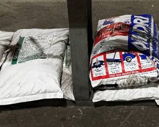 13 25lb Bags of Qwiksorb and 1 35lb Bag of Oil Dri Absorbent