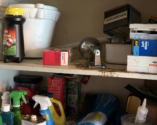 Lot 213: Garage shelf with cleaning products, oils, and hardware