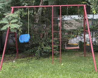Lot 70: Red metal swing set with bucket seat, rings, and ladder