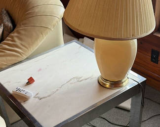 Lot 28: Beige ceramic table lamp with pleated shade on marble-top end table