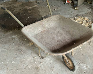 Lot 72: A wheelbarrow, life ring, and Slap Shot hockey tabletop
