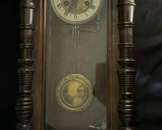 Lot 200: Vintage wall clock with pendulum in ornate wooden case