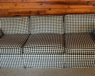 Lot 25: Gingham-patterned sofa with sleeper mattress
