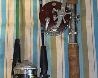 Lot 64: Two fishing rods with reels