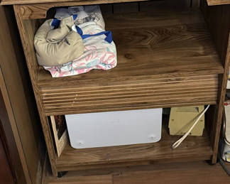 Lot 128: Wooden wheeled cabinet with clothing and electronics