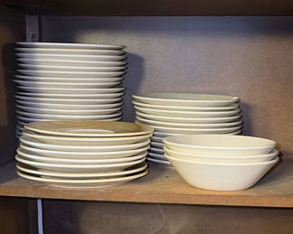 Lot 44: Stacked ceramic dinnerware (plates and bowls)