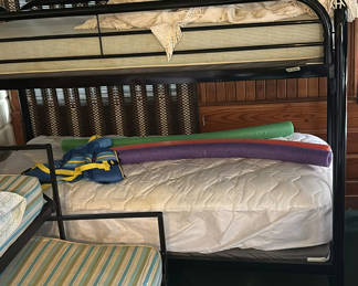 Lot 135: Black metal bunk bed with mattress and bedding accessories