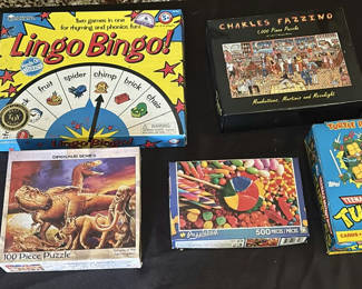 Lot 110: Assorted Board Games, Jigsaw Puzzles, Dominoes, and Trading Card Pack