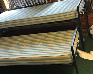 Lot 136: Metal bunk bed with striped mattresses