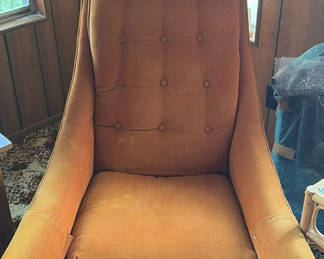 Lot 1: Orange tufted mid-century lounge chair