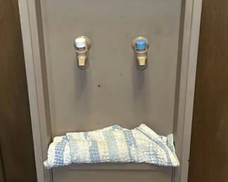 Lot 125: Metal water cooler dispenser with two taps and two 5-gallon water bottles
