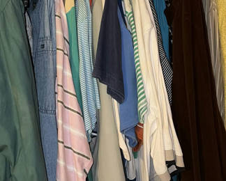 Lot 32: Closet with hanging clothes and footwear