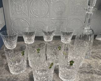 This magnificent vintage Waterford Crystal "Lismore" Wine Decanter is an authentic 1950s family heirloom piece, beautifully matching its corresponding stemware suite. Hand-cut in Ireland from heavy 24% full-lead crystal, the bottle features the pattern's signature uniform vertical wedge cuts and interlocking diamond facets, capped by its original mid-century tall prism stopper