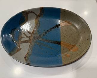 Vintage hand made pottery plater with different colored glazes