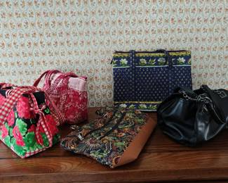 Various lady's purses, handbags, and totes