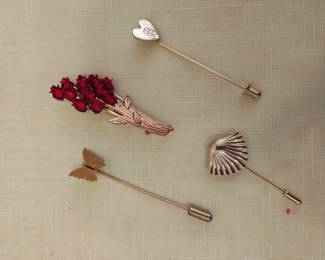 Samples of various stick pin jewelry