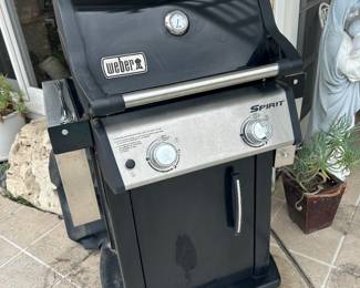 Weber BBQ with propane tank and cover. 