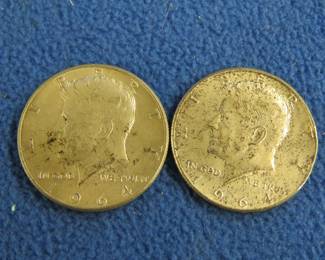 Lot 69. Two 1964 Kennedy silver half dollars