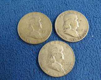 Lot 63. Three Benjamin Franklin silver half dollars