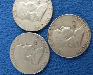Lot 64. Three Benjamin Franklin silver half dollars