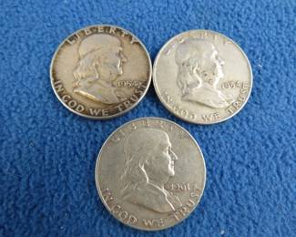 Lot 65. Three Benjamin Franklin silver half dollars