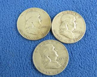 Lot 66. Three Benjamin Franklin silver half dollars