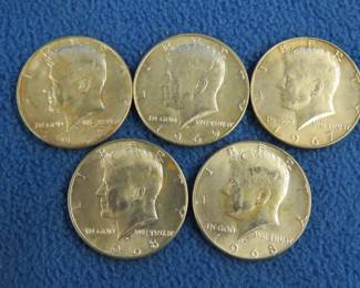 Lot 73. Five 40% silver Kennedy half dollars