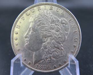 Lot 240. 1886 P Morgan silver dollar