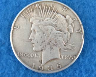 Lot 169. 1935 P Peace silver dollar