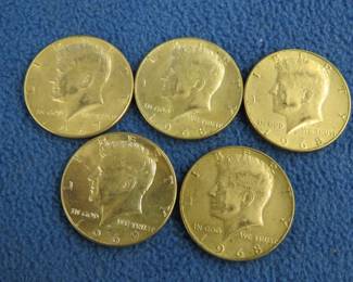 Lot 74. Five 40% silver Kennedy half dollars