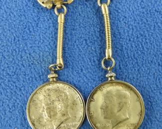 Lot 38. Two silver 1964 Kennedy half-dollars in bezels
