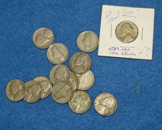 Lot 292. 14 Jefferson nickels from the 1940s and 1950s including two silver war nickels and a possible 1962 mint error Jefferson.