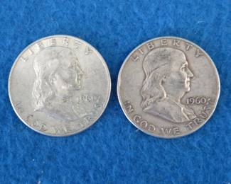 Lot 210. Two Franklin half dollars