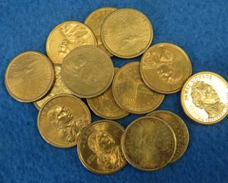 Lot 270. 13 Sacagawea and one James Monroe dollar coins.