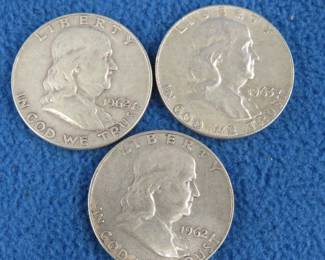 Lot 29. Three Benjamin Franklin silver half-dollars